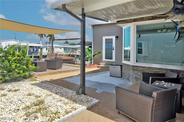 a outdoor space with patio the couches and a dining table with garden view
