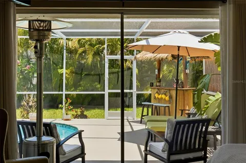 a view of a house with a yard and sitting area