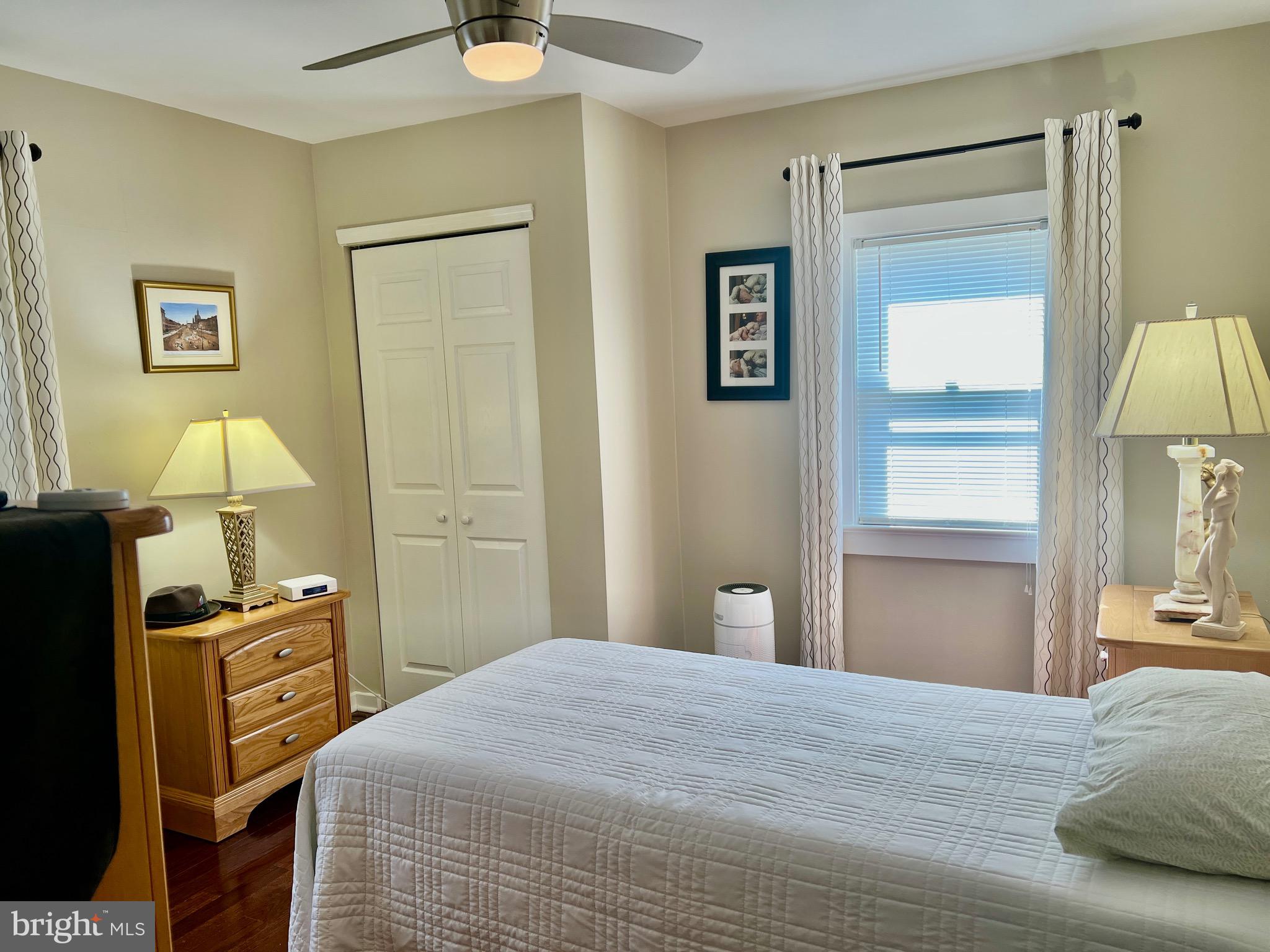 87 Saybrook Avenue Hamilton, NJ 08619 - Photo 12 of 41 a bedroom with a bed and a lamp on the dresser