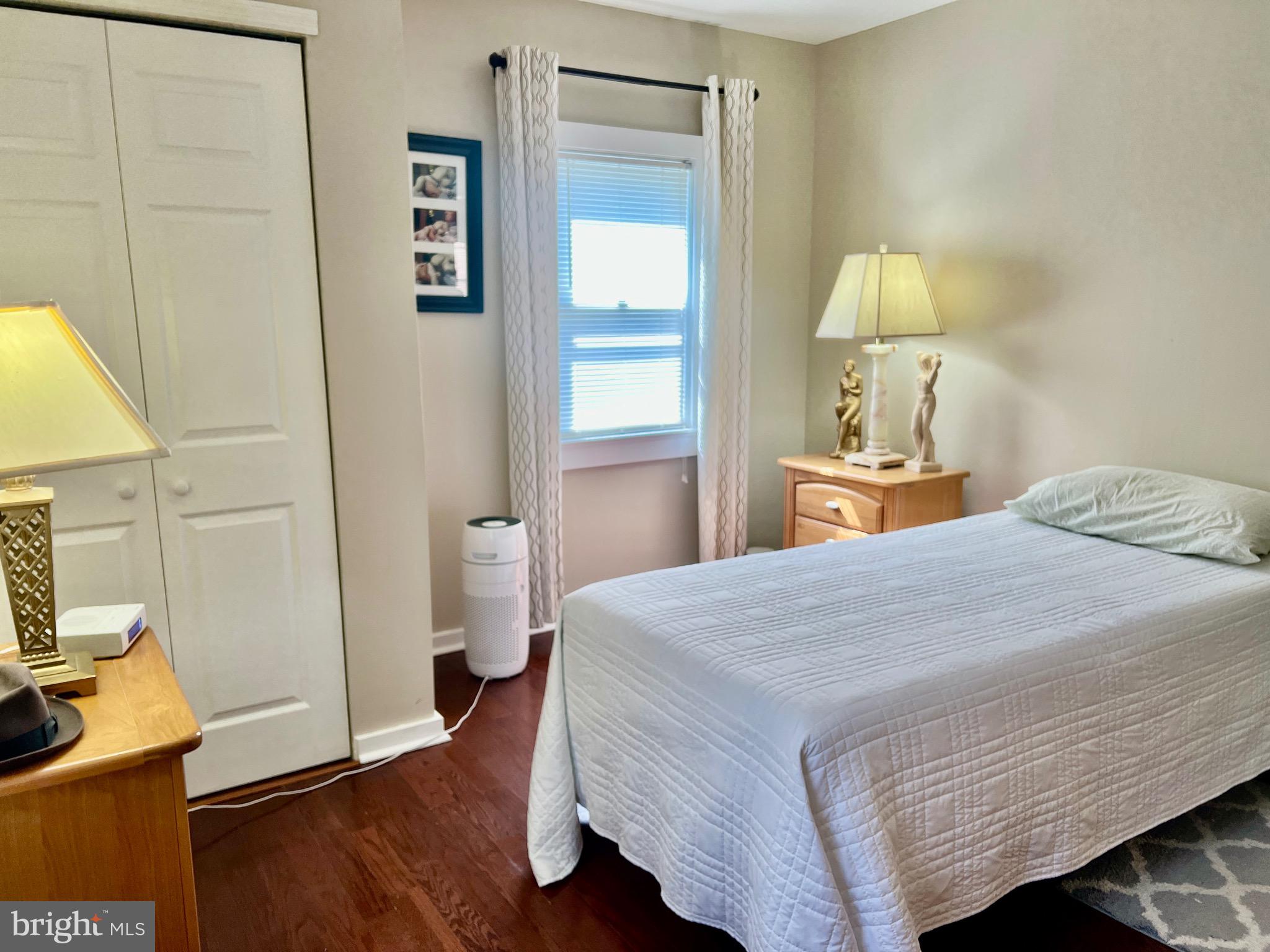 87 Saybrook Avenue Hamilton, NJ 08619 - Photo 13 of 41 a bedroom with a bed and a flat tv screen on dresser
