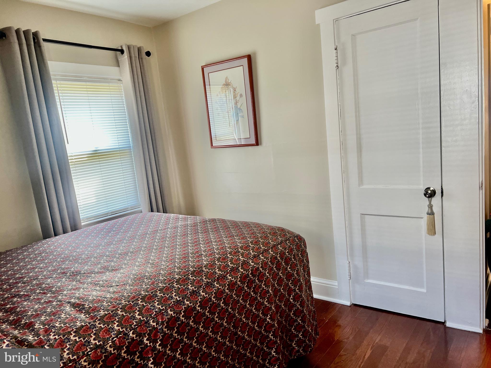 87 Saybrook Avenue Hamilton, NJ 08619 - Photo 16 of 41 a bedroom with a bed and a mirror