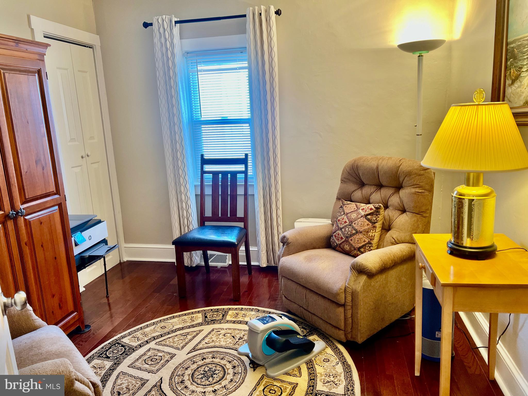 87 Saybrook Avenue Hamilton, NJ 08619 - Photo 17 of 41 a living room with furniture and a lamp