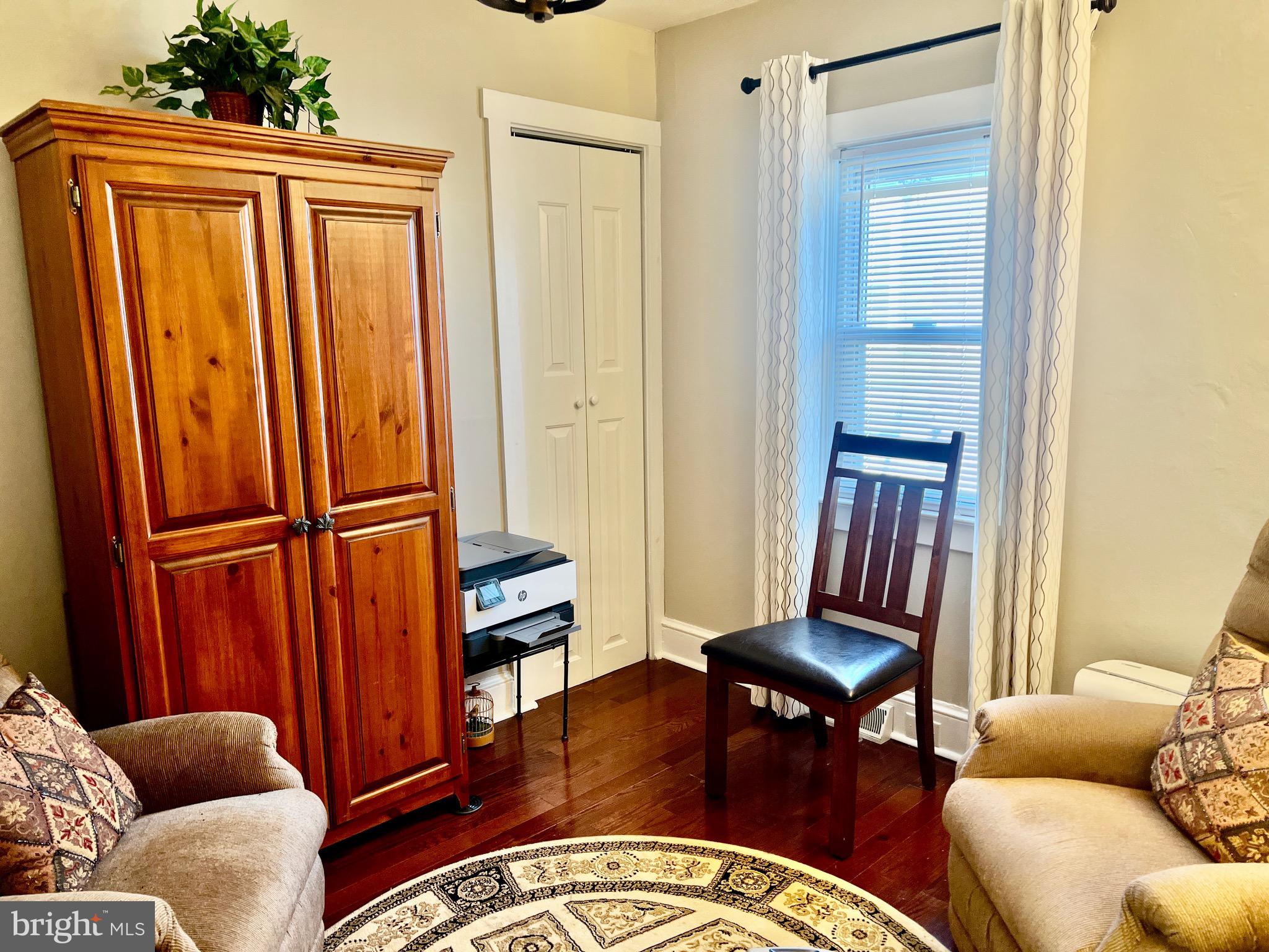 87 Saybrook Avenue Hamilton, NJ 08619 - Photo 18 of 41 a living room with furniture a rug and a window