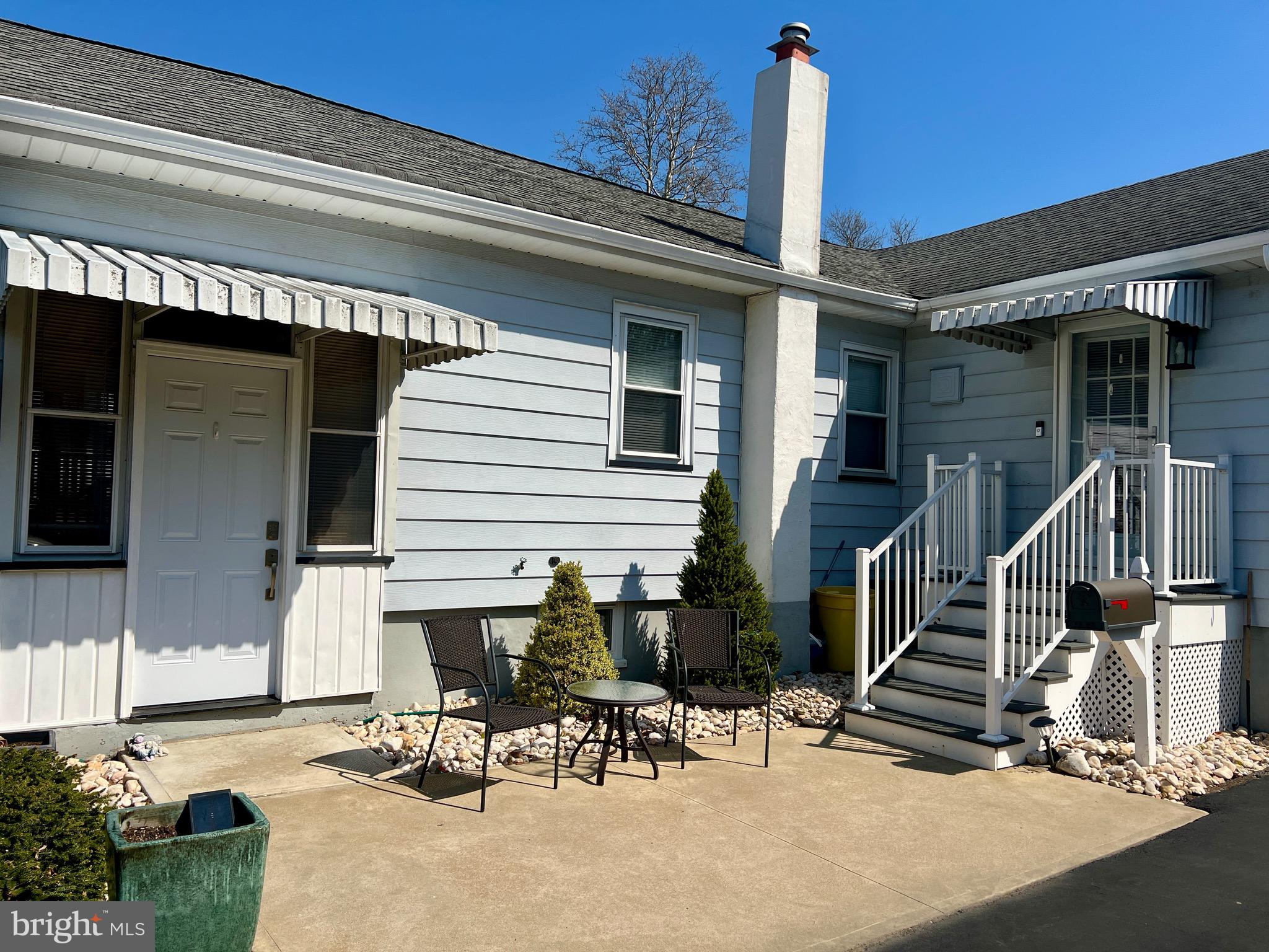 87 Saybrook Avenue Hamilton, NJ 08619 - Photo 2 of 41 a front view of a house with outdoor seating