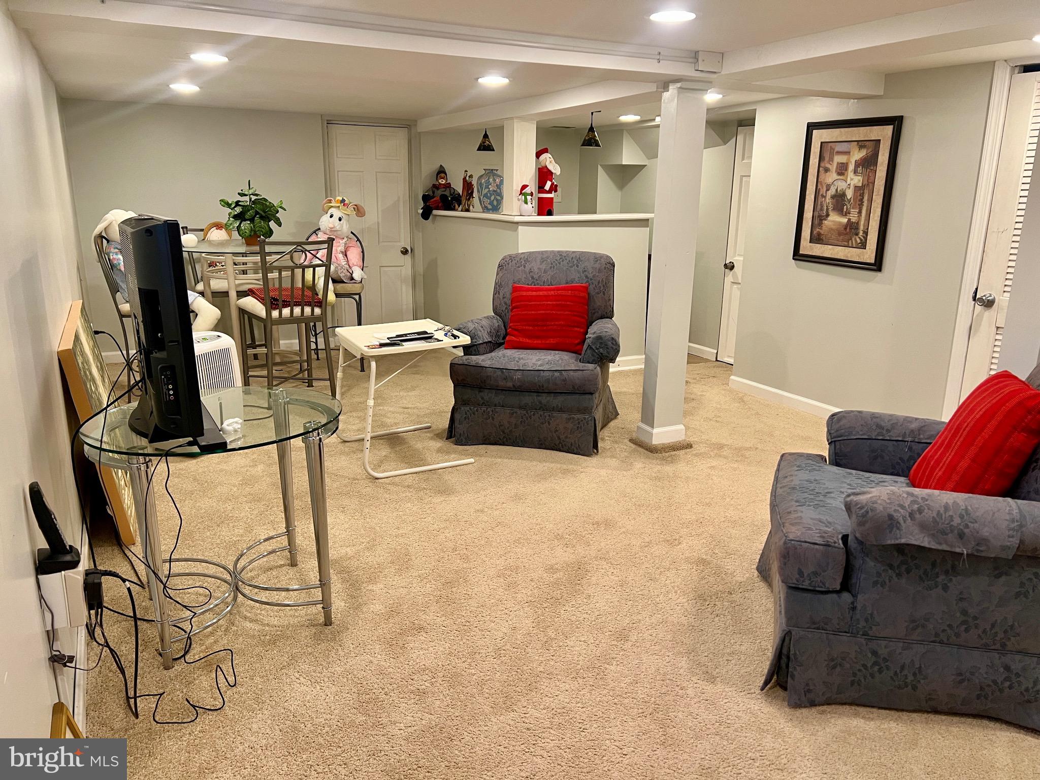 87 Saybrook Avenue Hamilton, NJ 08619 - Photo 24 of 41 a living room with furniture and a flat screen tv