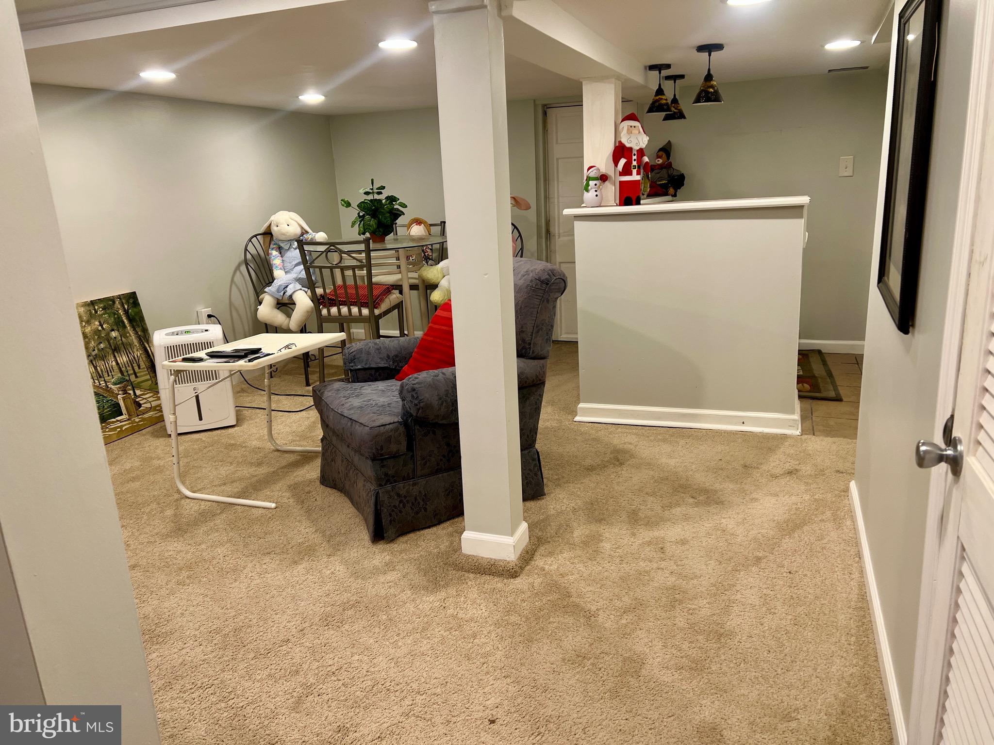 87 Saybrook Avenue Hamilton, NJ 08619 - Photo 25 of 41 a living room with furniture and a flat screen tv