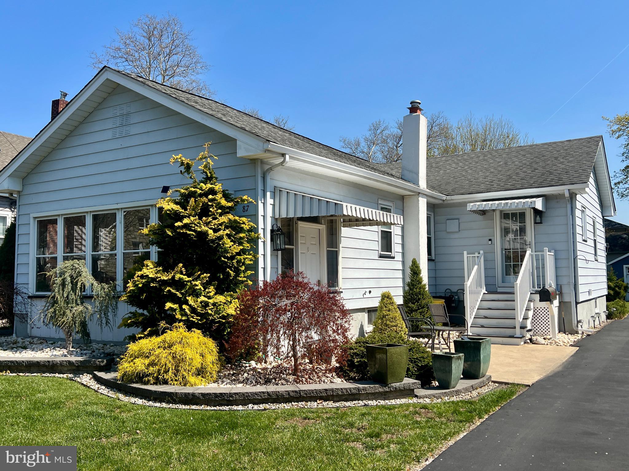 87 Saybrook Avenue Hamilton, NJ 08619 - Photo 41 of 41 a front view of a house with a porch and a fountain