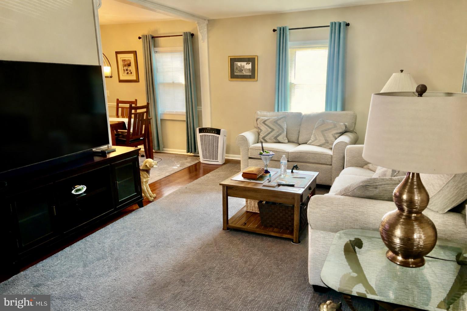 87 Saybrook Avenue Hamilton, NJ 08619 - Photo 10 of 41 a living room with furniture and a flat screen tv