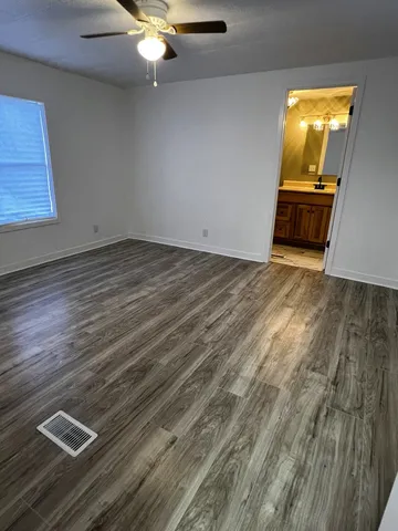 a view of kitchen and wooden floor