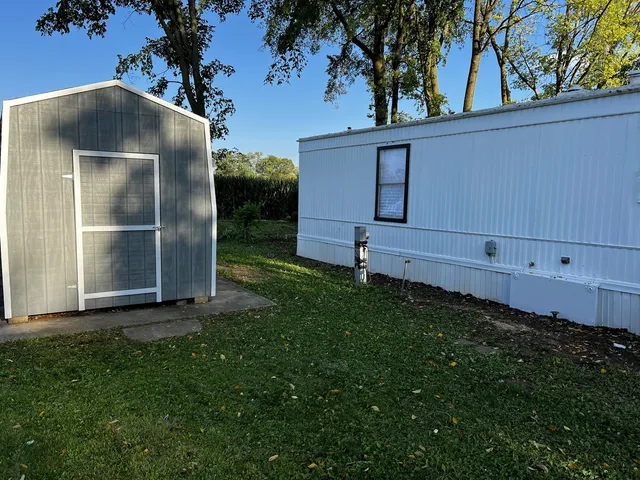 a backyard of a house with lots of green space