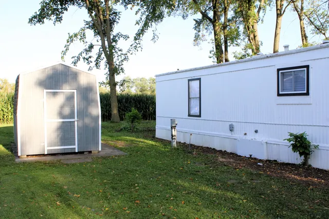 a backyard of a house with lots of green space