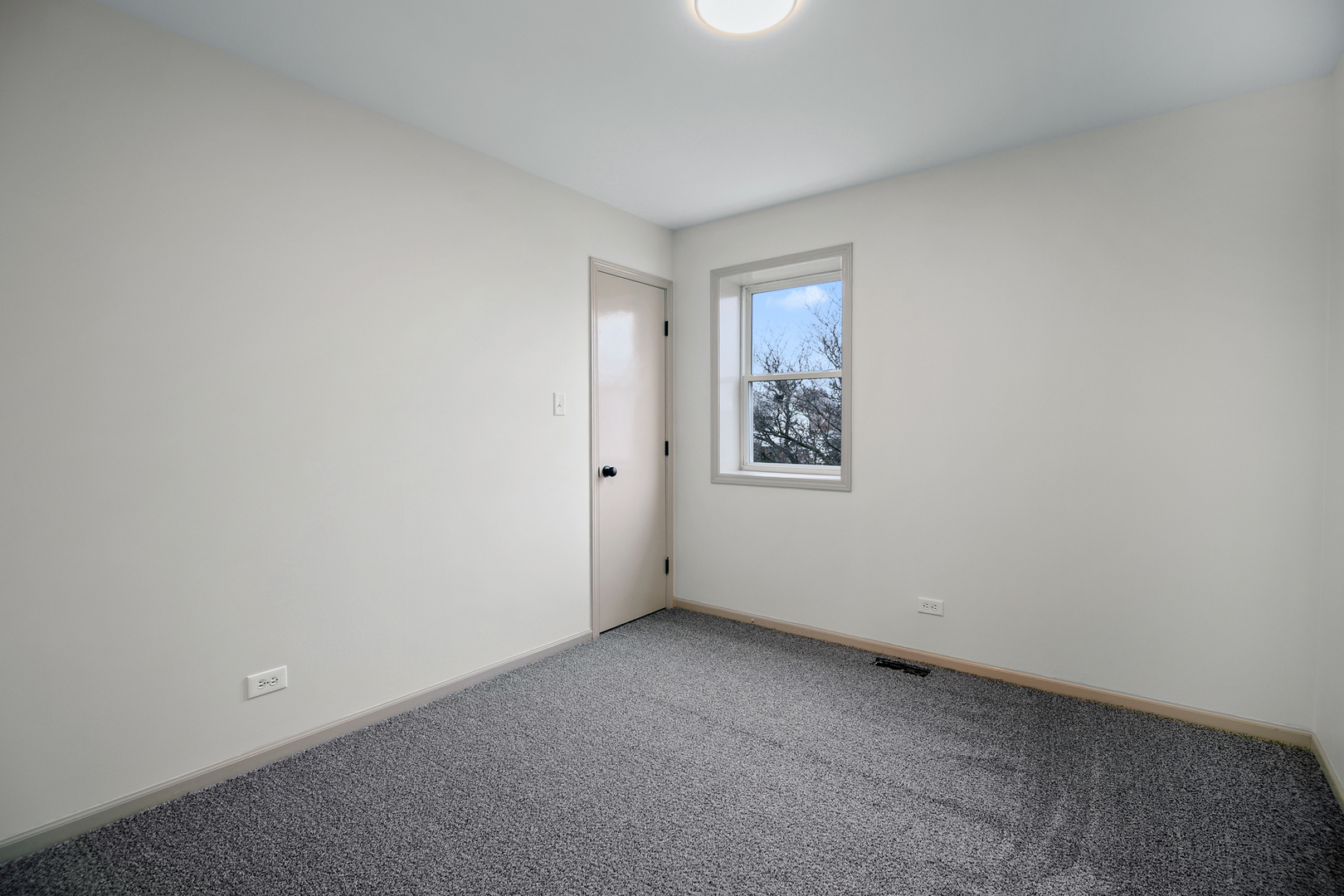 1320 South 3rd Avenue Kankakee, IL 60901 - Photo 13 of 19 a view of an empty room with a window