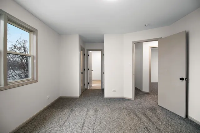 a view of a room with wooden floor and closet