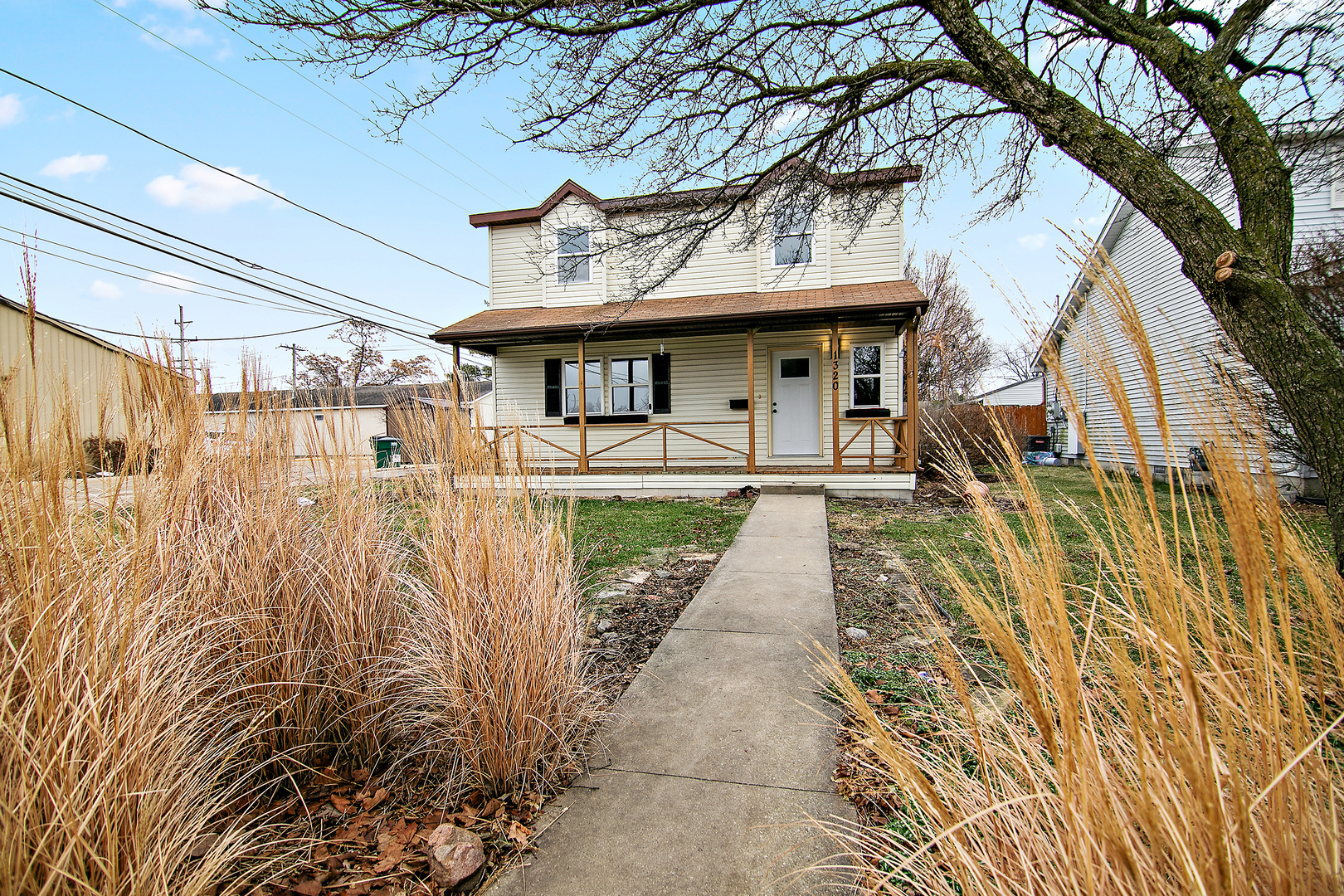 1320 South 3rd Avenue Kankakee, IL 60901 - Photo 19 of 19 a front view of a house with a garden