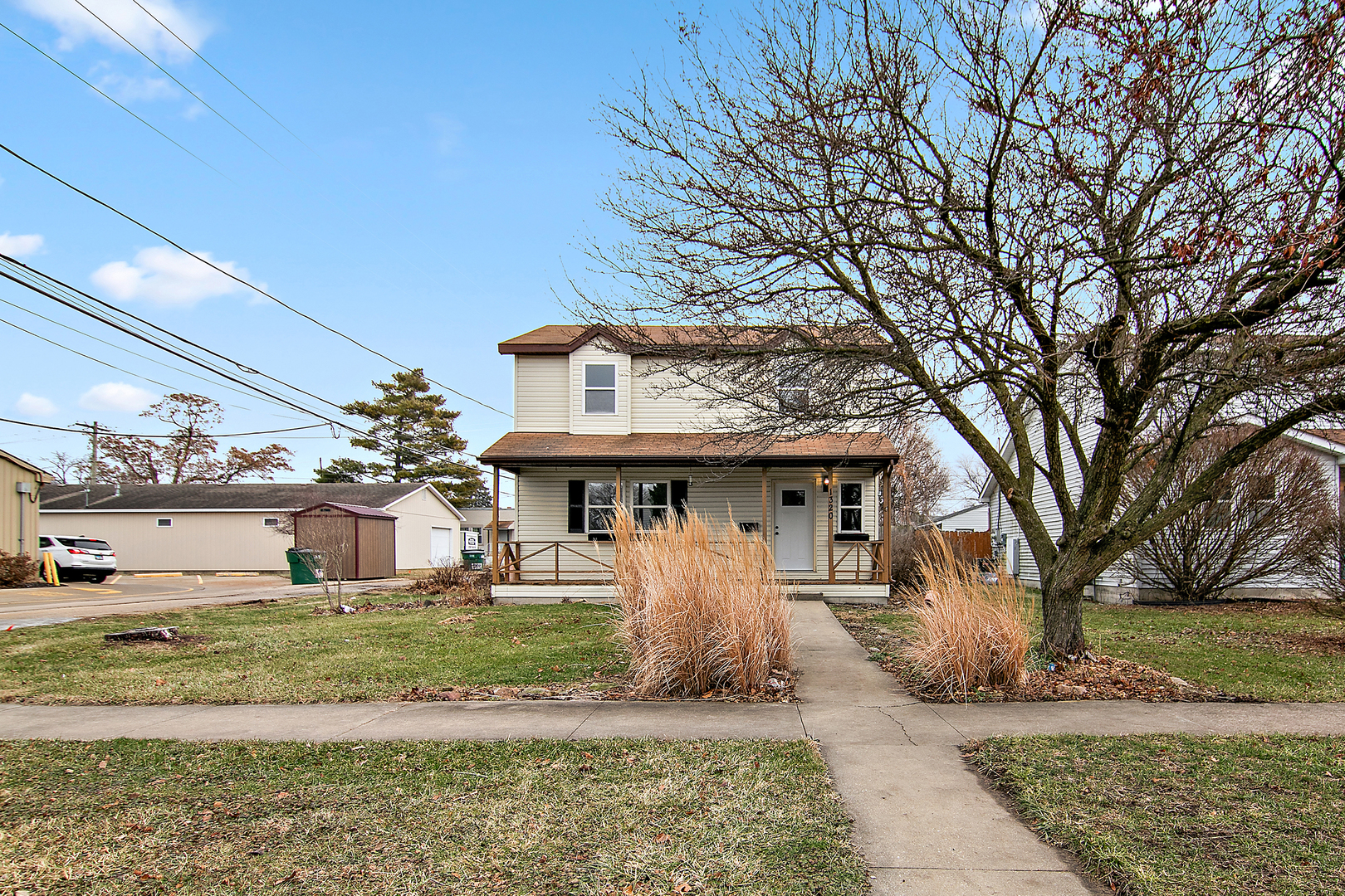 1320 South 3rd Avenue Kankakee, IL 60901 - Photo 2 of 19 a front view of a house with garden
