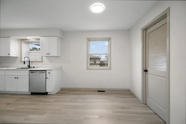 a view of a kitchen with a sink