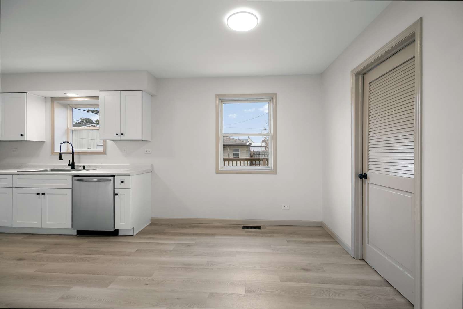 1320 South 3rd Avenue Kankakee, IL 60901 - Photo 6 of 19 a view of a kitchen with a sink