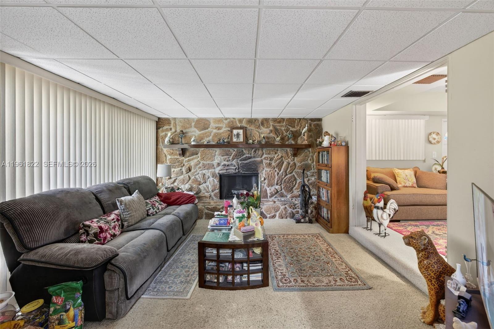 9401 Southwest 97th Avenue Miami, FL 33176 - Photo 11 of 77 a living room with furniture and a fireplace