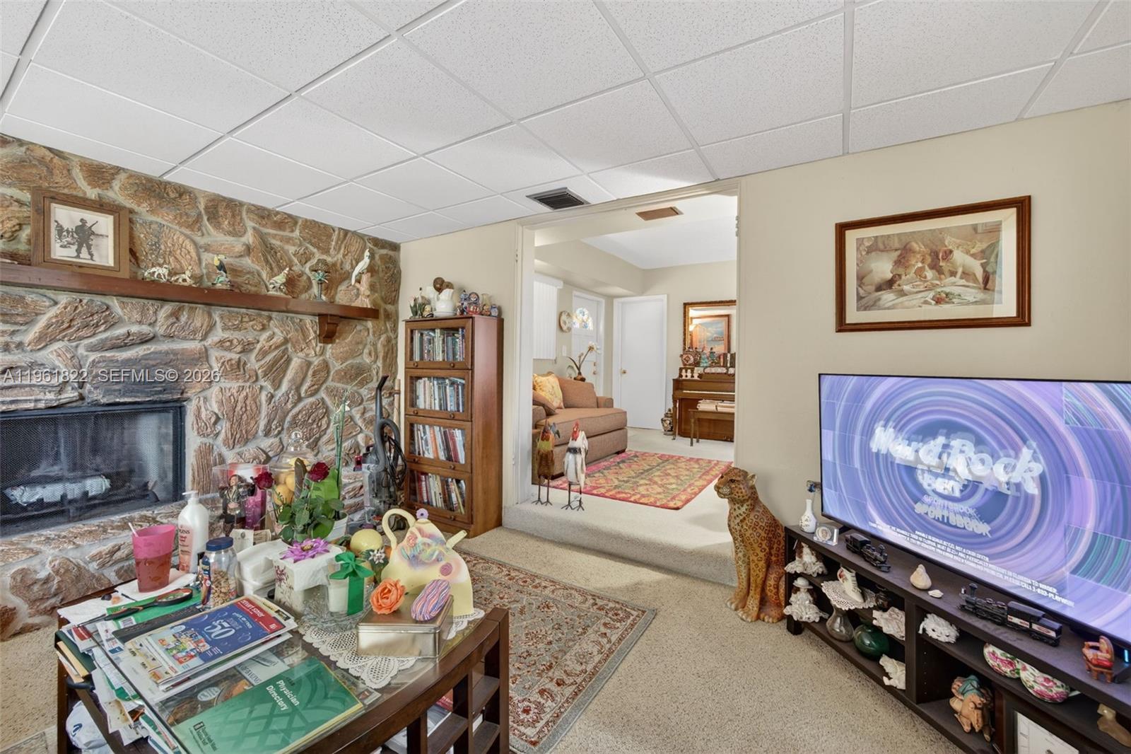 9401 Southwest 97th Avenue Miami, FL 33176 - Photo 12 of 77 a living room with furniture and a flat screen tv