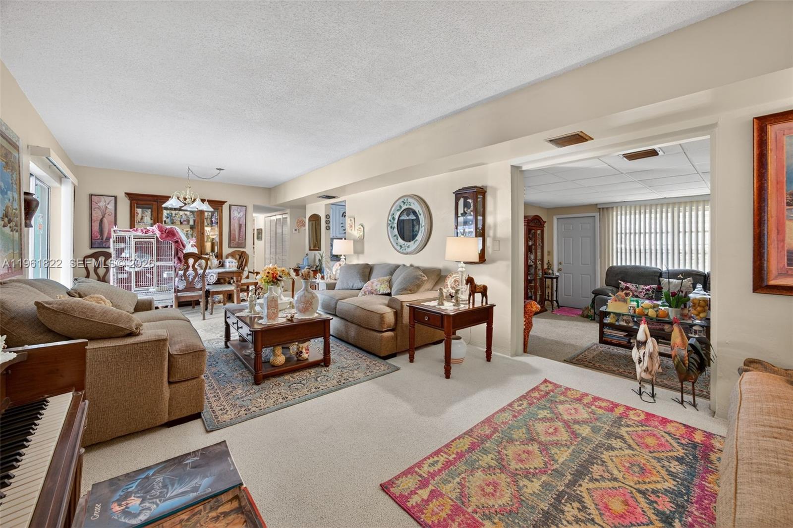 9401 Southwest 97th Avenue Miami, FL 33176 - Photo 15 of 77 a living room with furniture potted plant and a rug