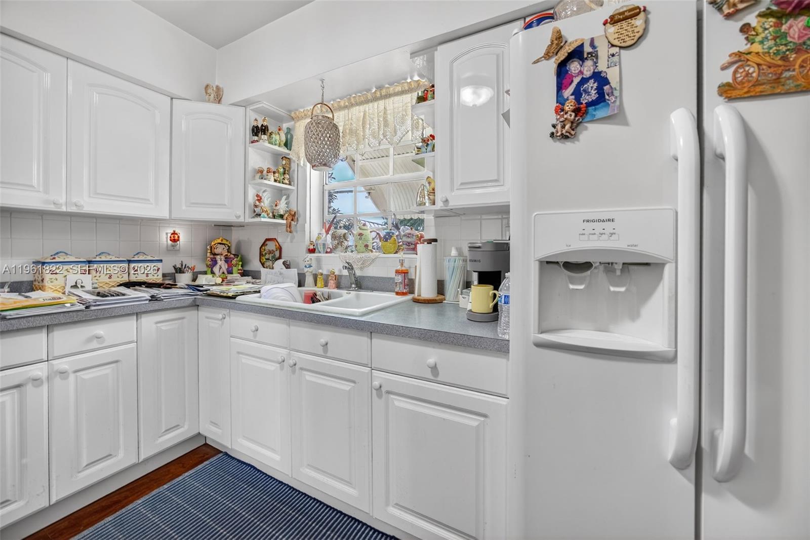 9401 Southwest 97th Avenue Miami, FL 33176 - Photo 18 of 77 a kitchen with cabinets and wooden floor