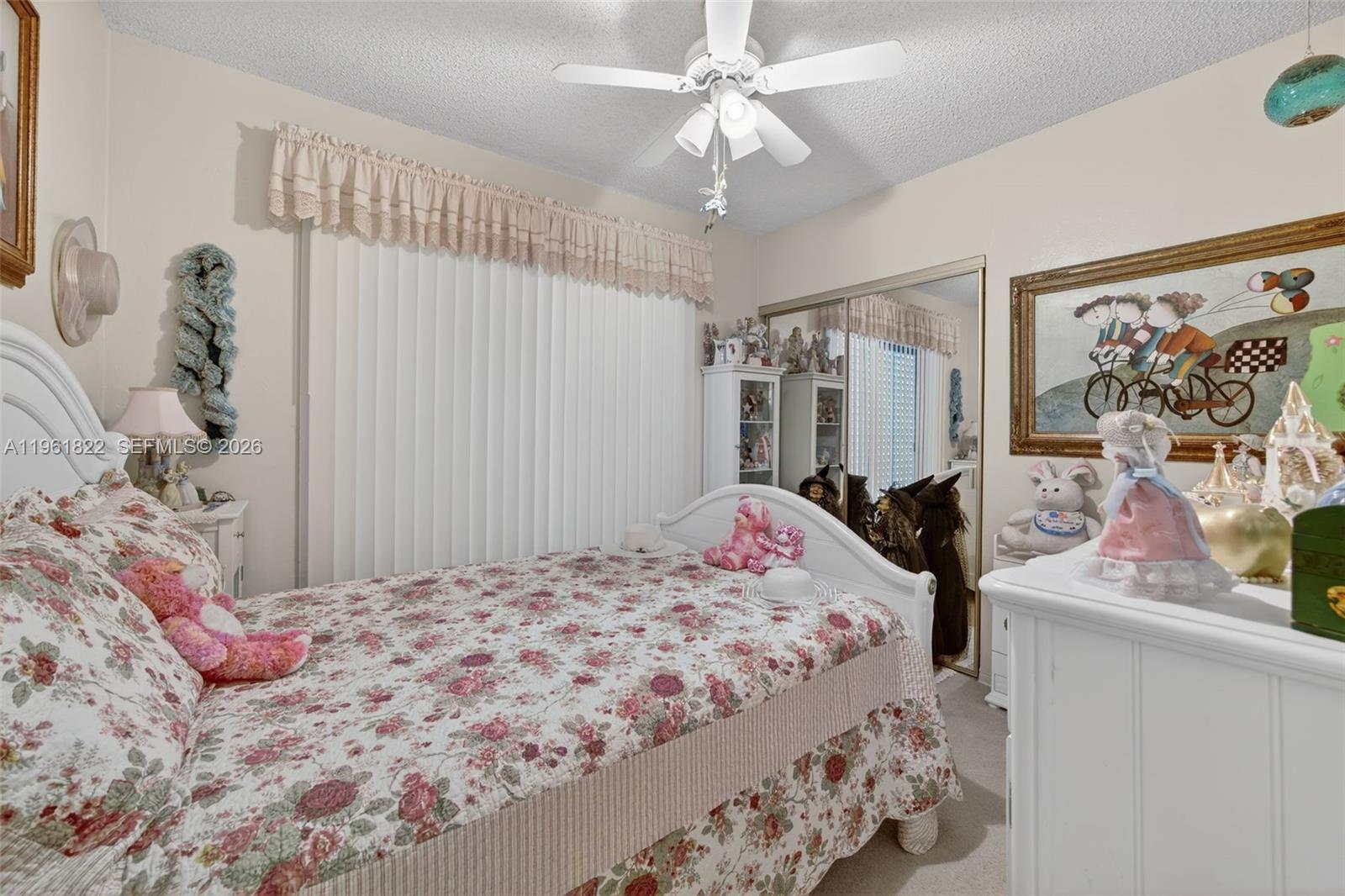 9401 Southwest 97th Avenue Miami, FL 33176 - Photo 27 of 77 a bedroom with a bed and a chandelier