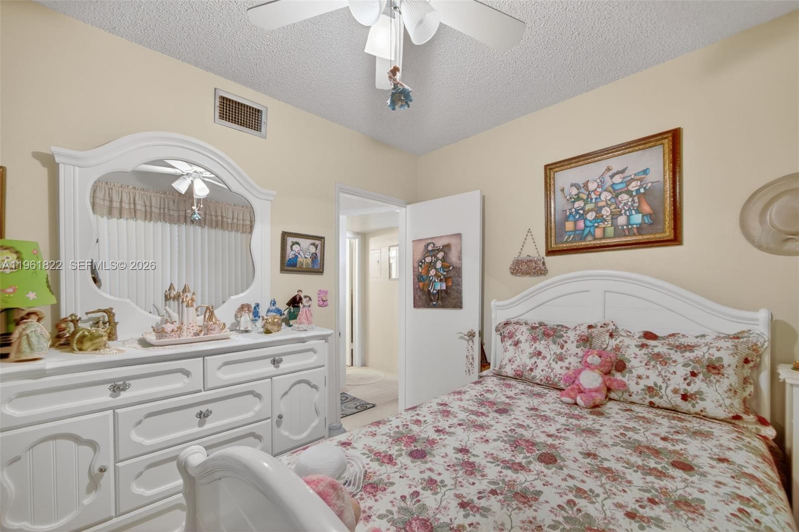 9401 Southwest 97th Avenue Miami, FL 33176 - Photo 29 of 77 a bedroom with a large bed and a window