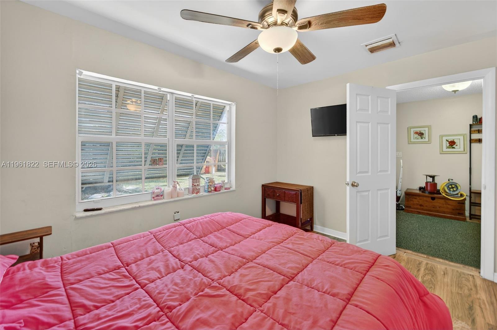 9401 Southwest 97th Avenue Miami, FL 33176 - Photo 33 of 77 a bedroom with a bed and a large window