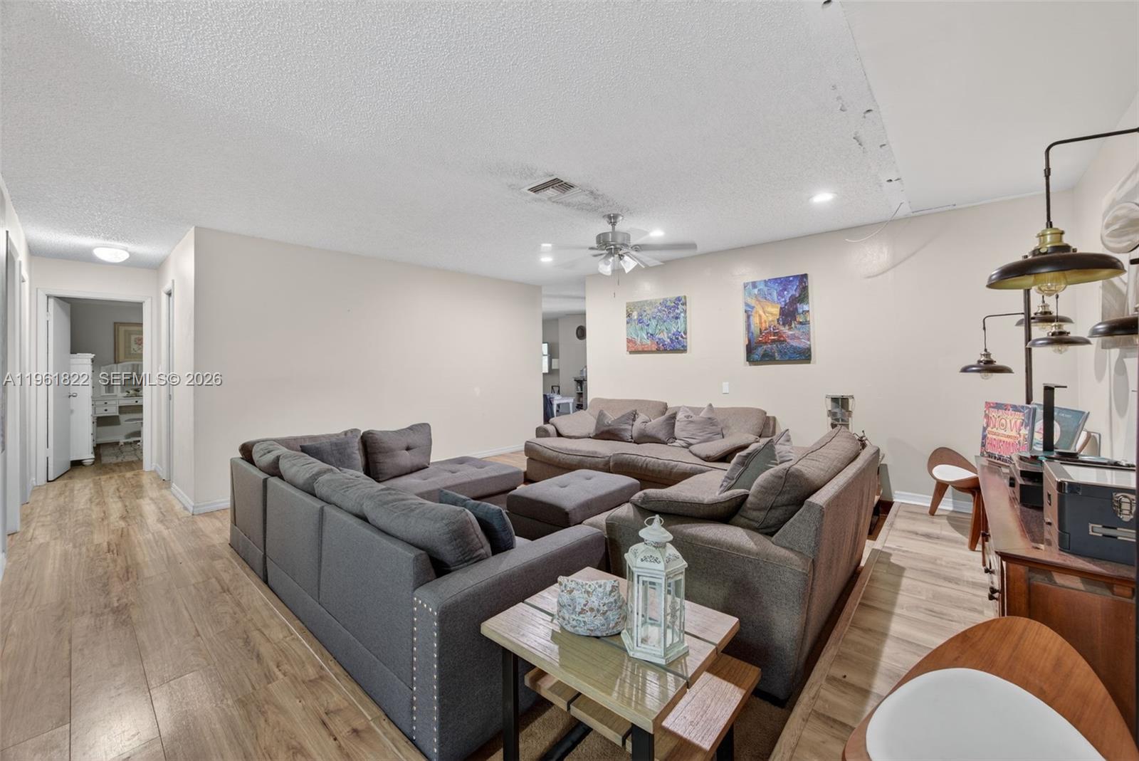 9401 Southwest 97th Avenue Miami, FL 33176 - Photo 36 of 77 a living room with furniture kitchen view and a wooden floor