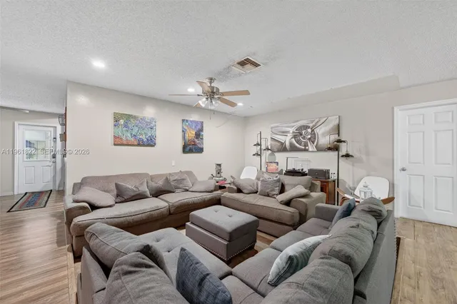 a view of a house with swimming pool and porch
