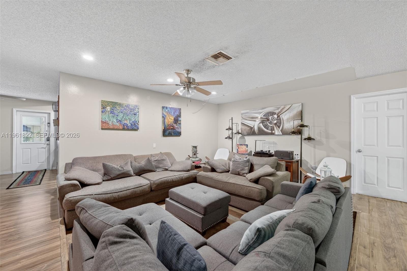 9401 Southwest 97th Avenue Miami, FL 33176 - Photo 37 of 77 a living room with furniture and a couch