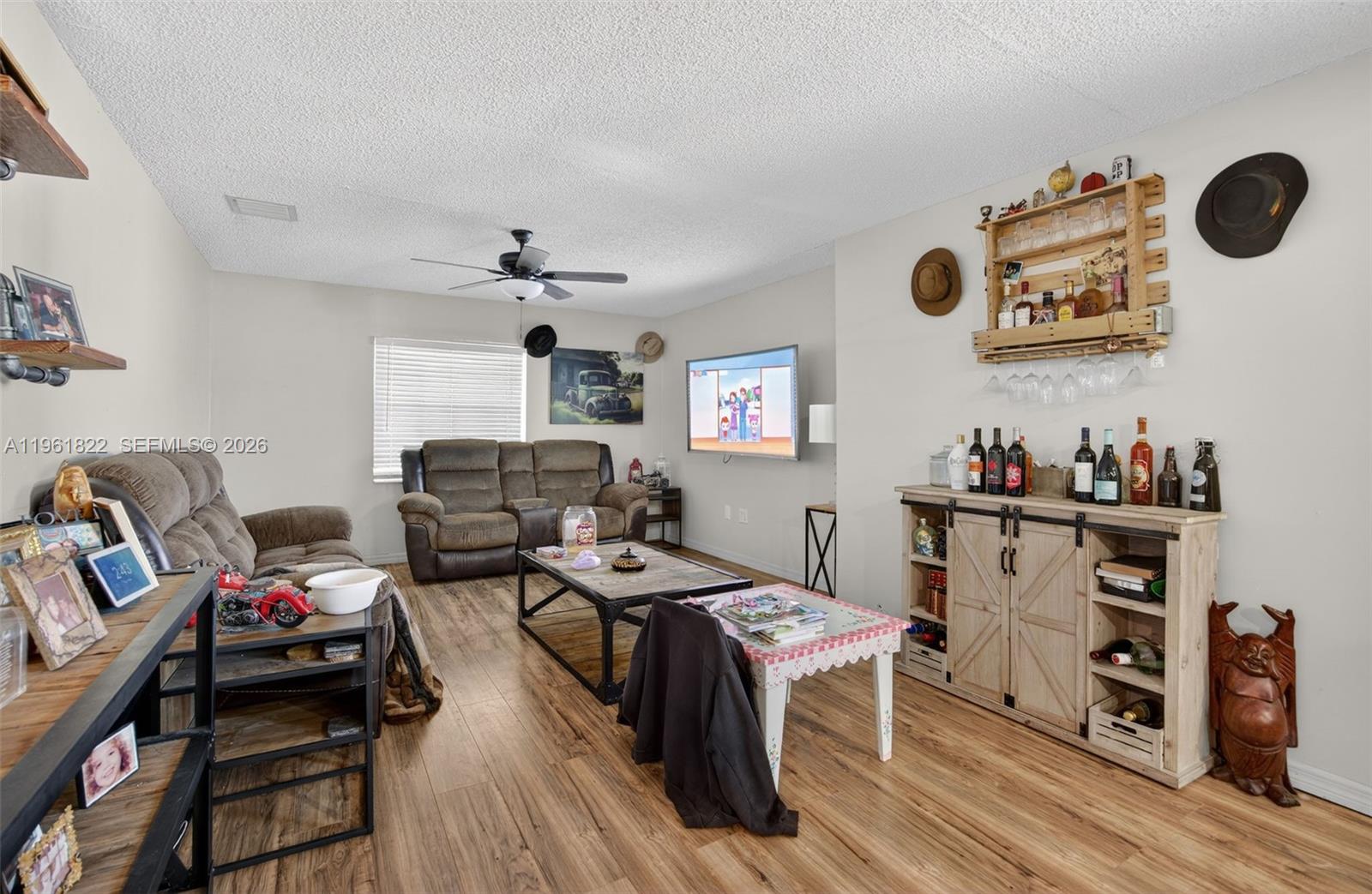 9401 Southwest 97th Avenue Miami, FL 33176 - Photo 39 of 77 a view of a workspace with furniture and wooden floor
