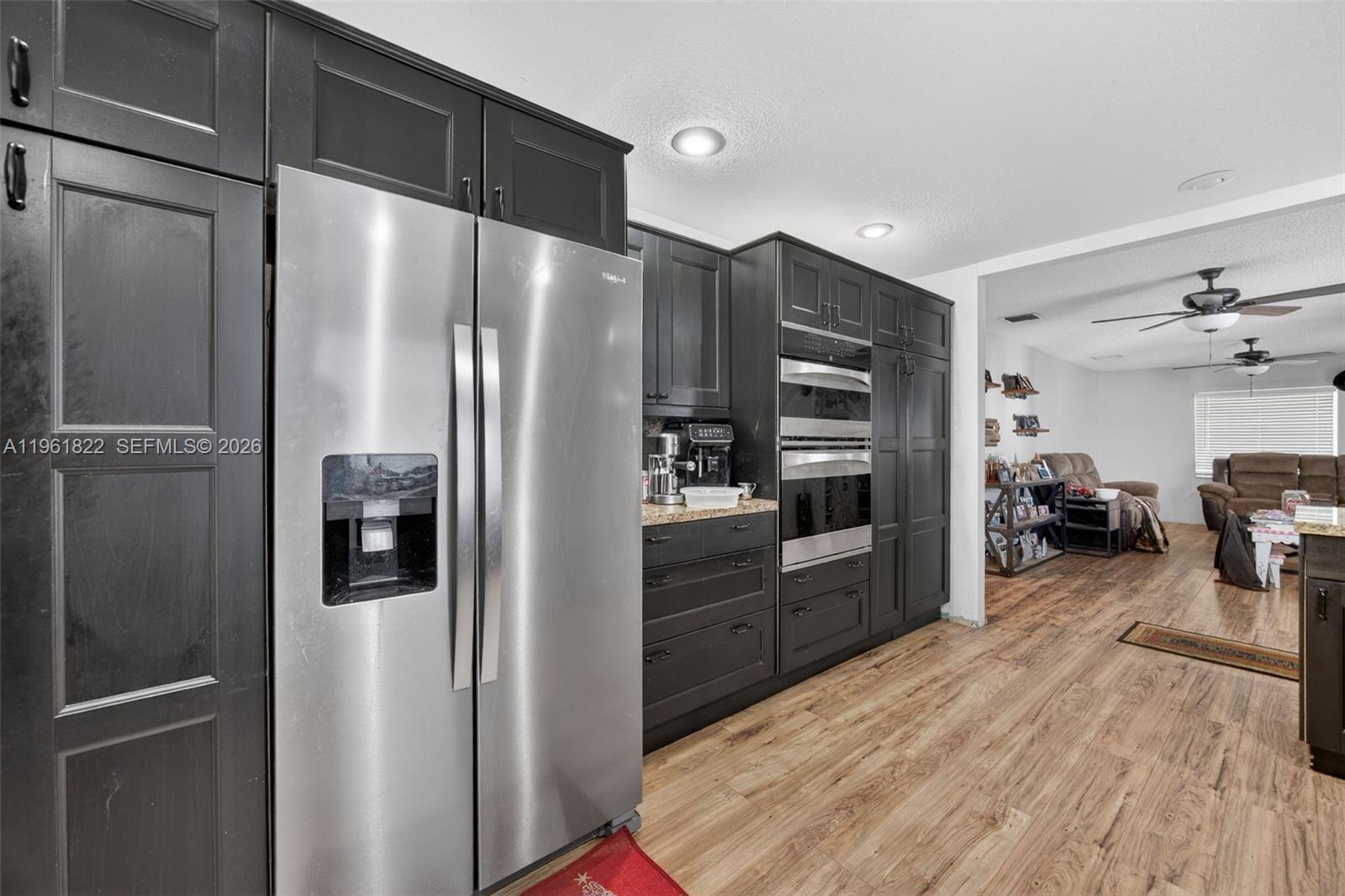 9401 Southwest 97th Avenue Miami, FL 33176 - Photo 43 of 77 a kitchen with stainless steel appliances a refrigerator and a stove top oven