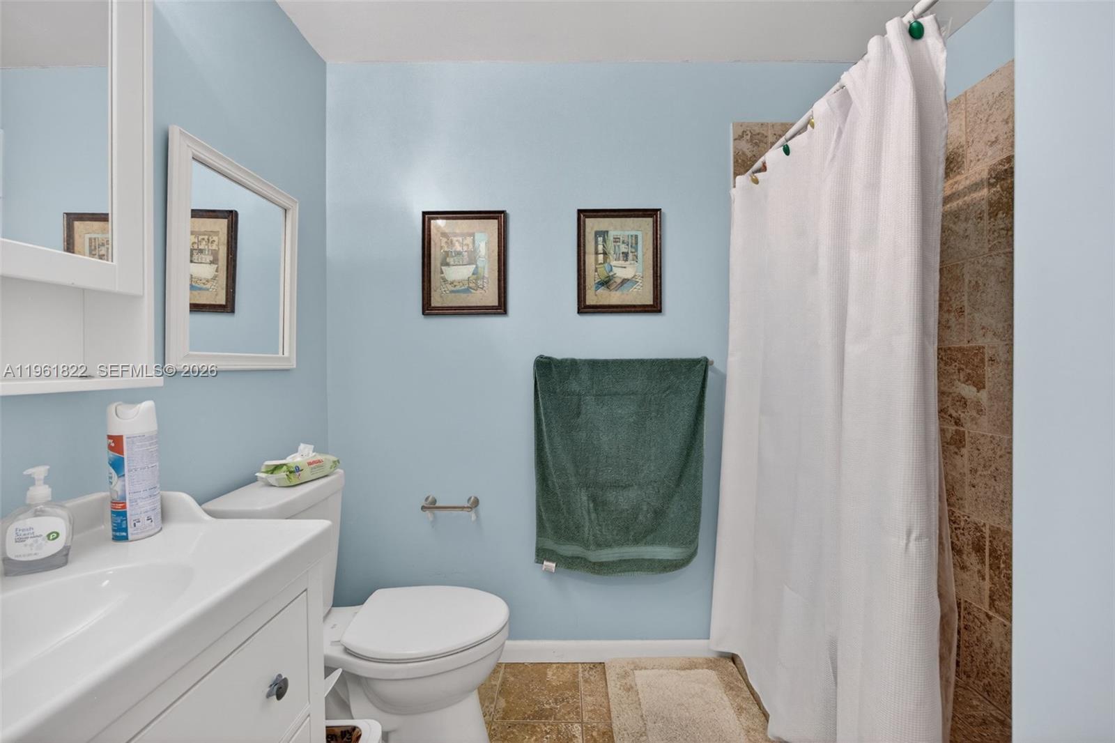 9401 Southwest 97th Avenue Miami, FL 33176 - Photo 48 of 77 a white toilet sitting next to a bathroom sink