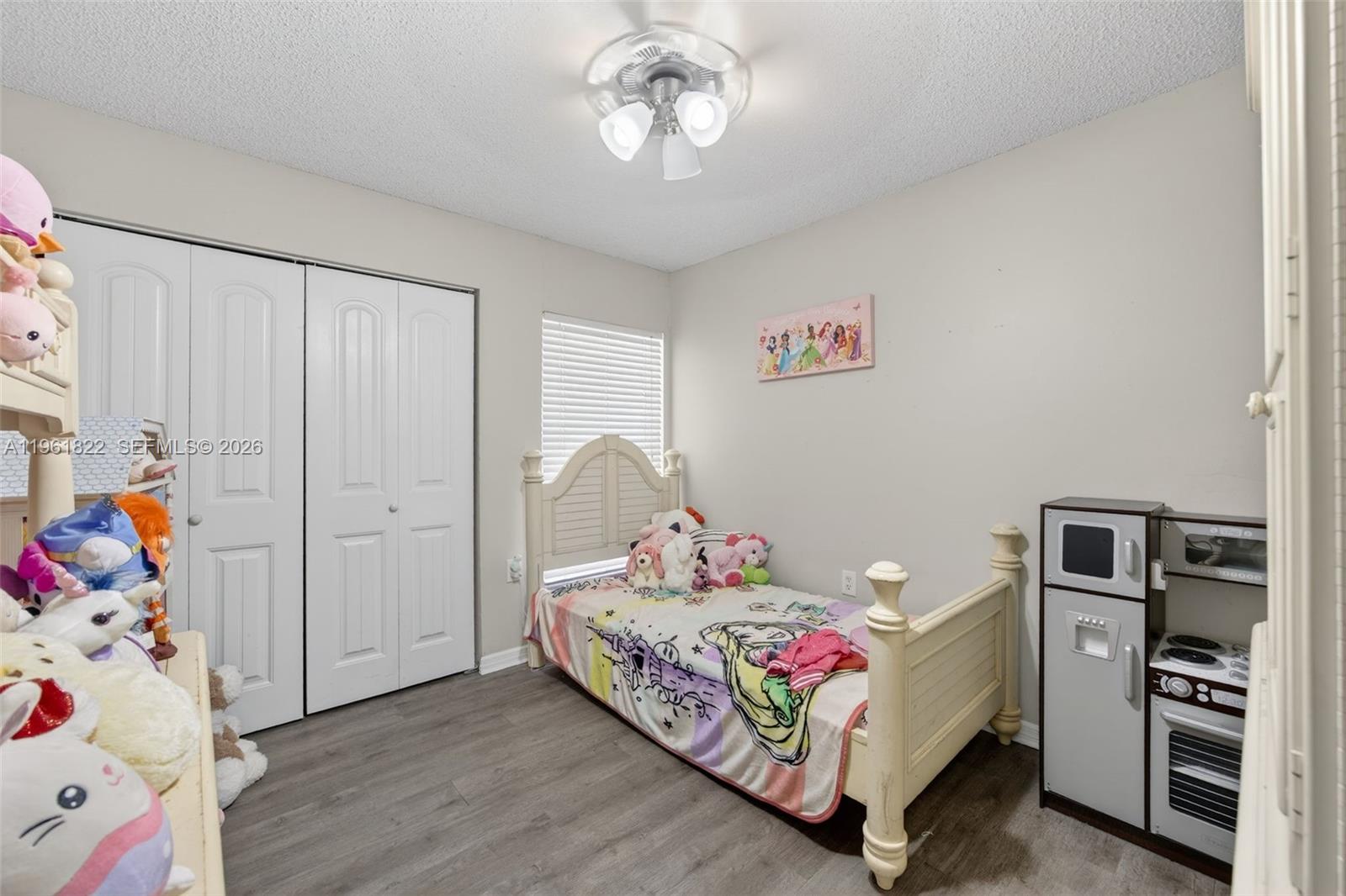 9401 Southwest 97th Avenue Miami, FL 33176 - Photo 54 of 77 a bedroom with a bed and wooden floor