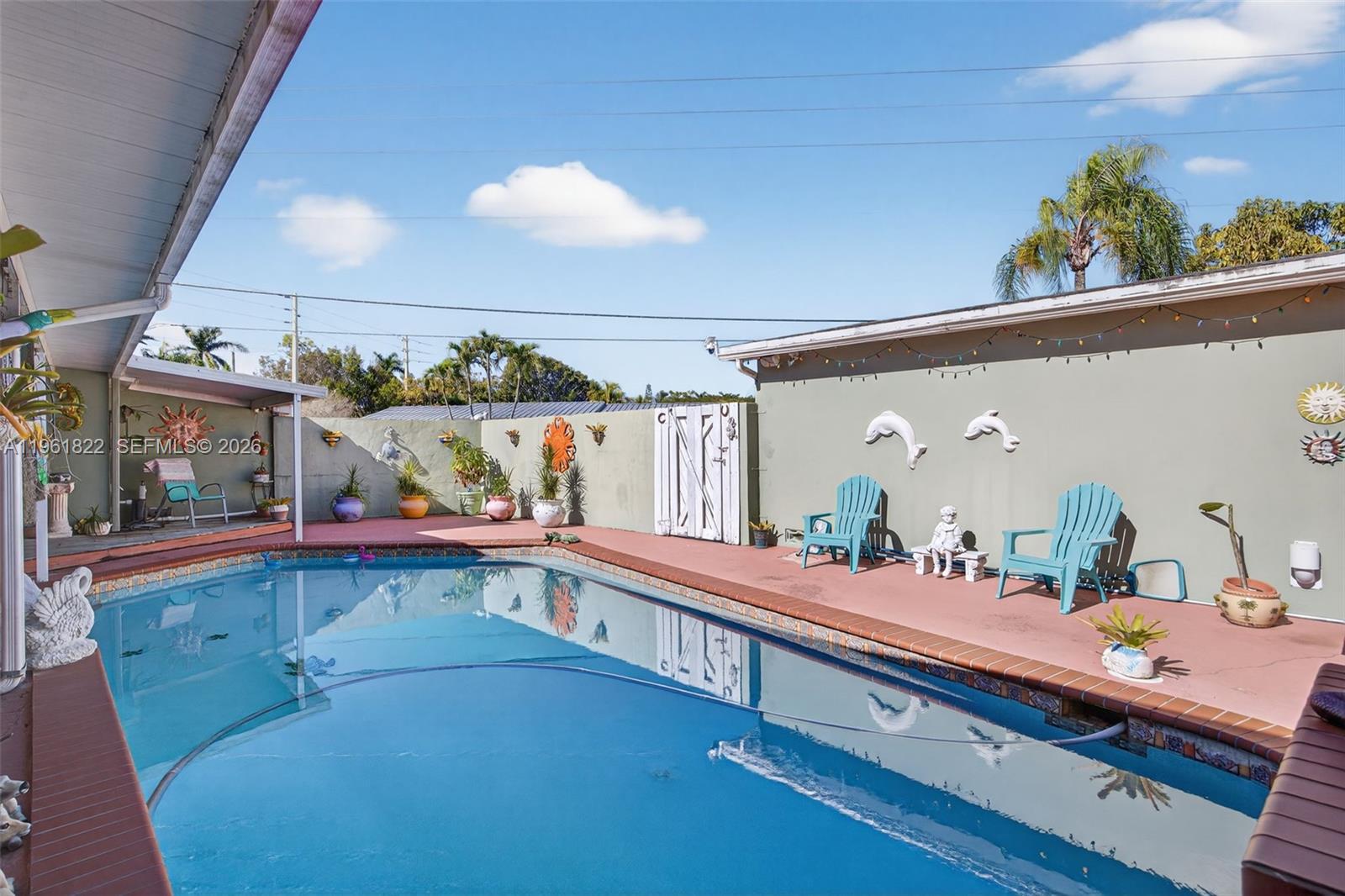 9401 Southwest 97th Avenue Miami, FL 33176 - Photo 64 of 77 a bathroom with a double vanity sink and a mirror
