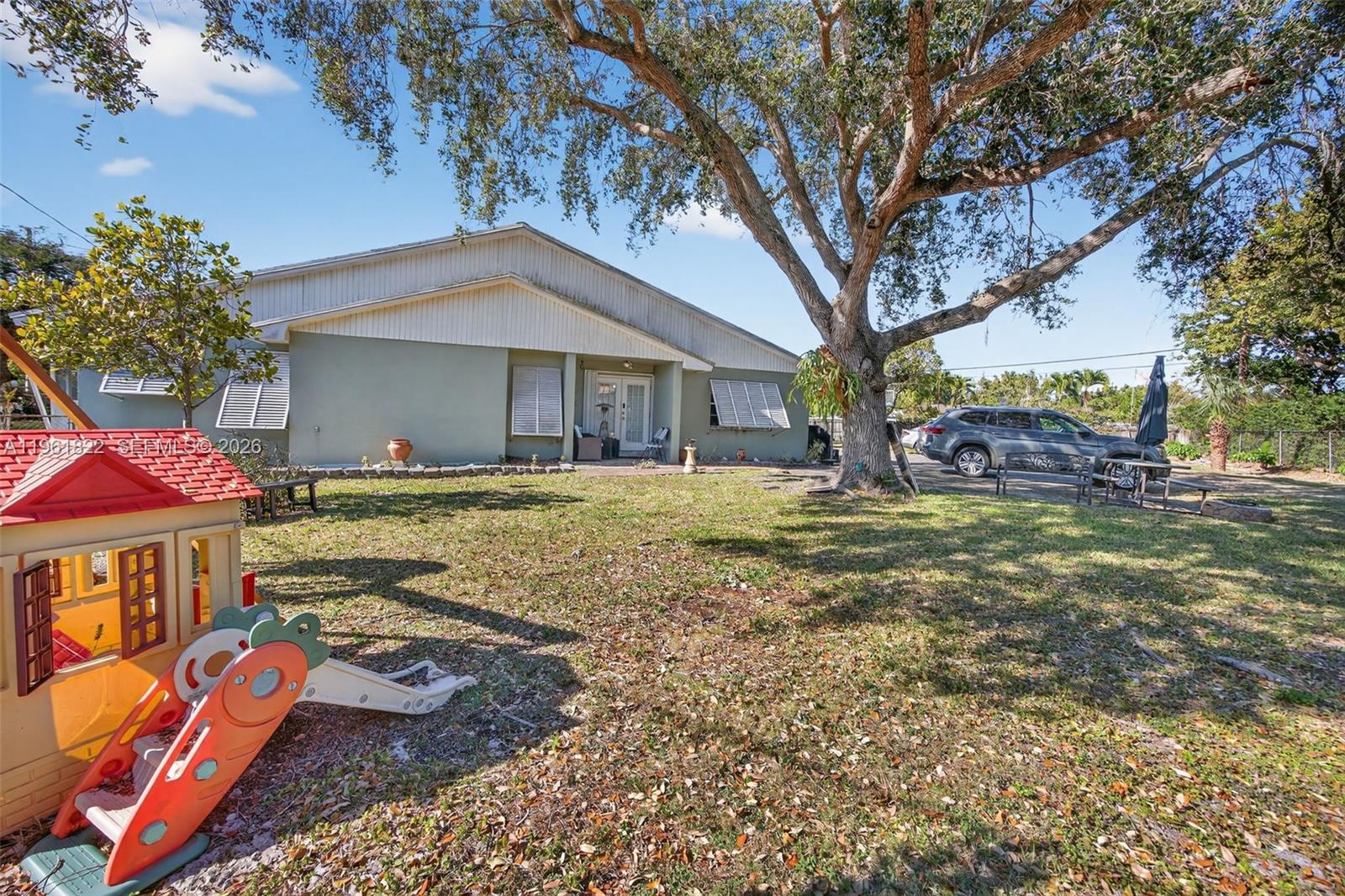 9401 Southwest 97th Avenue Miami, FL 33176 - Photo 69 of 77 a front view of a house with garden