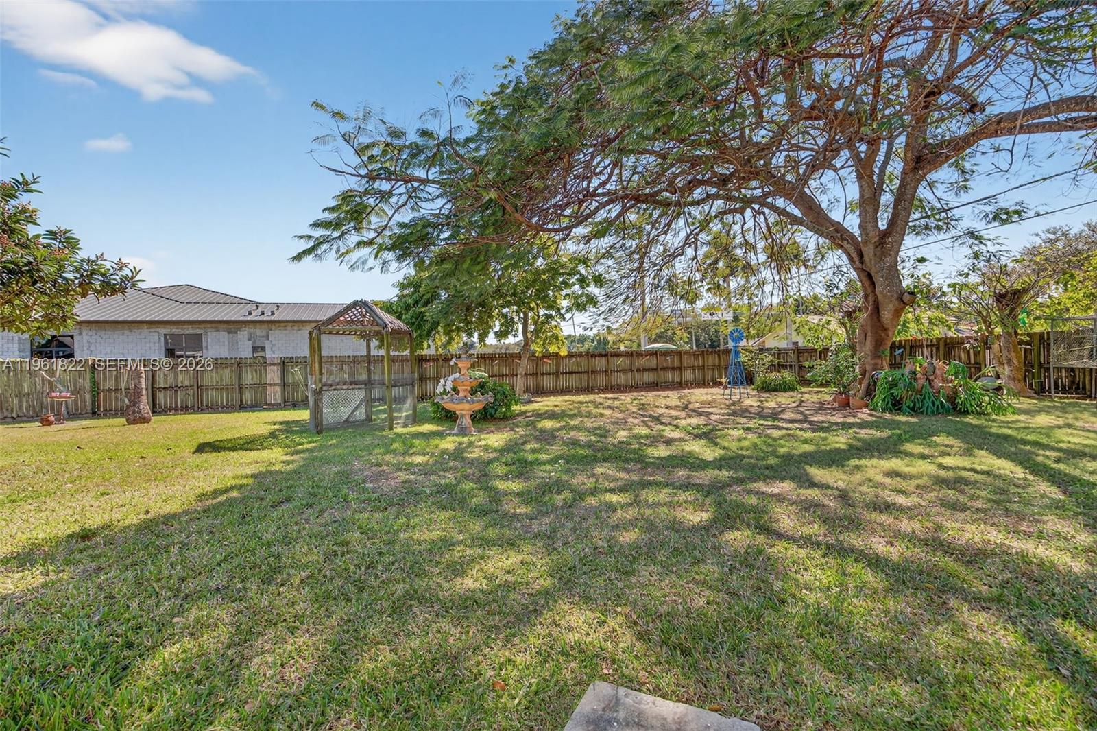 9401 Southwest 97th Avenue Miami, FL 33176 - Photo 71 of 77 a view of yard with swimming pool and sitting area