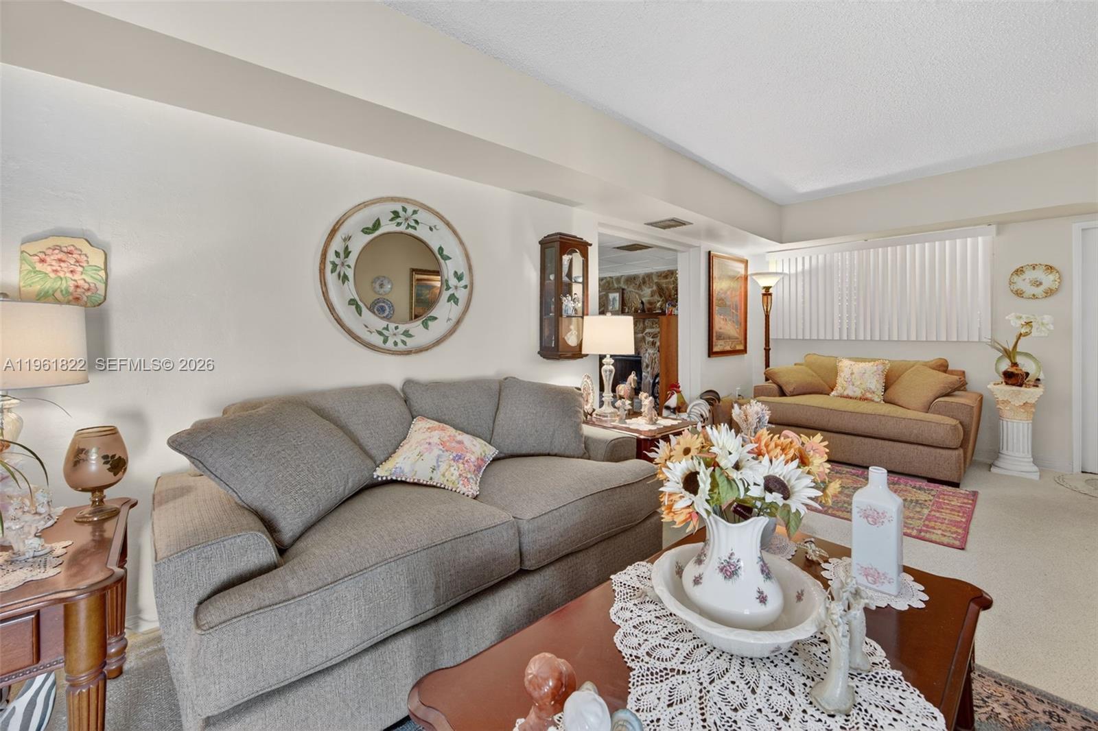 9401 Southwest 97th Avenue Miami, FL 33176 - Photo 10 of 77 a living room with furniture a clock and a window