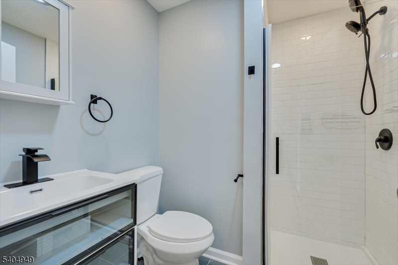 34 Tillman Street Raritan, NJ 08869 - Photo 18 of 31 a bathroom with a sink toilet and shower