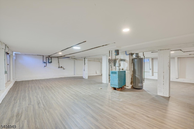 34 Tillman Street Raritan, NJ 08869 - Photo 23 of 31 an empty room with wooden floor and windows