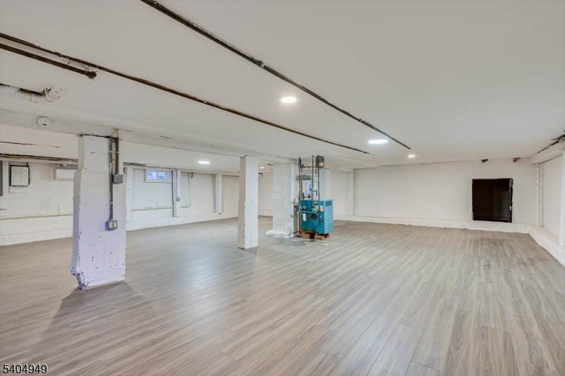 34 Tillman Street Raritan, NJ 08869 - Photo 24 of 31 a view of an empty room with wooden floor and a window