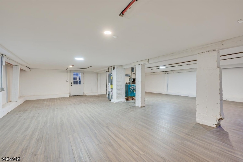 34 Tillman Street Raritan, NJ 08869 - Photo 25 of 31 a view of an empty room with wooden floor