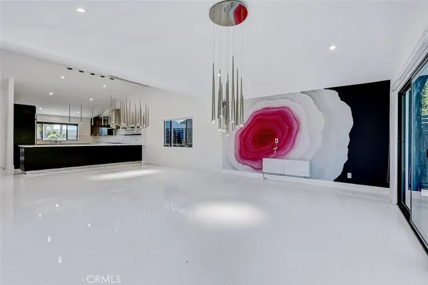 a view of kitchen with stainless steel appliances granite countertop sink stove and refrigerator