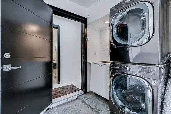 a close view of a in a utility room with dryer and washer