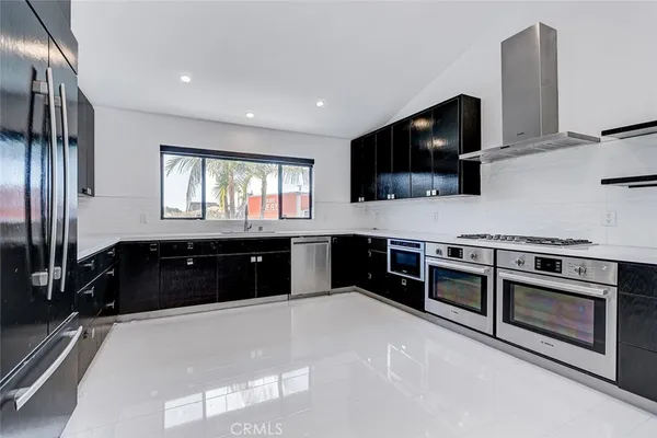 a kitchen with a stove and a microwave