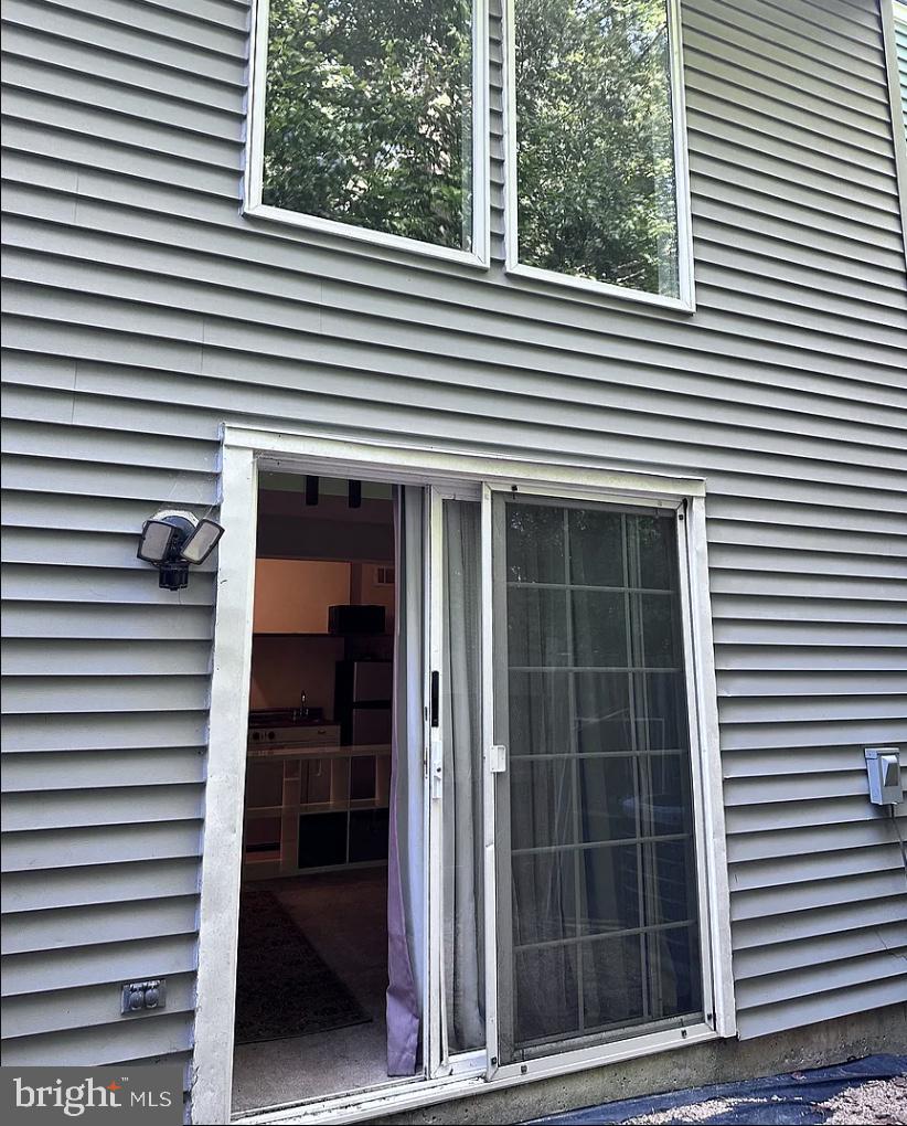 13939 Palmer House Way, Unit 28207 Silver Spring, MD 20904 - Photo 1 of 8 a view of a house with a large window