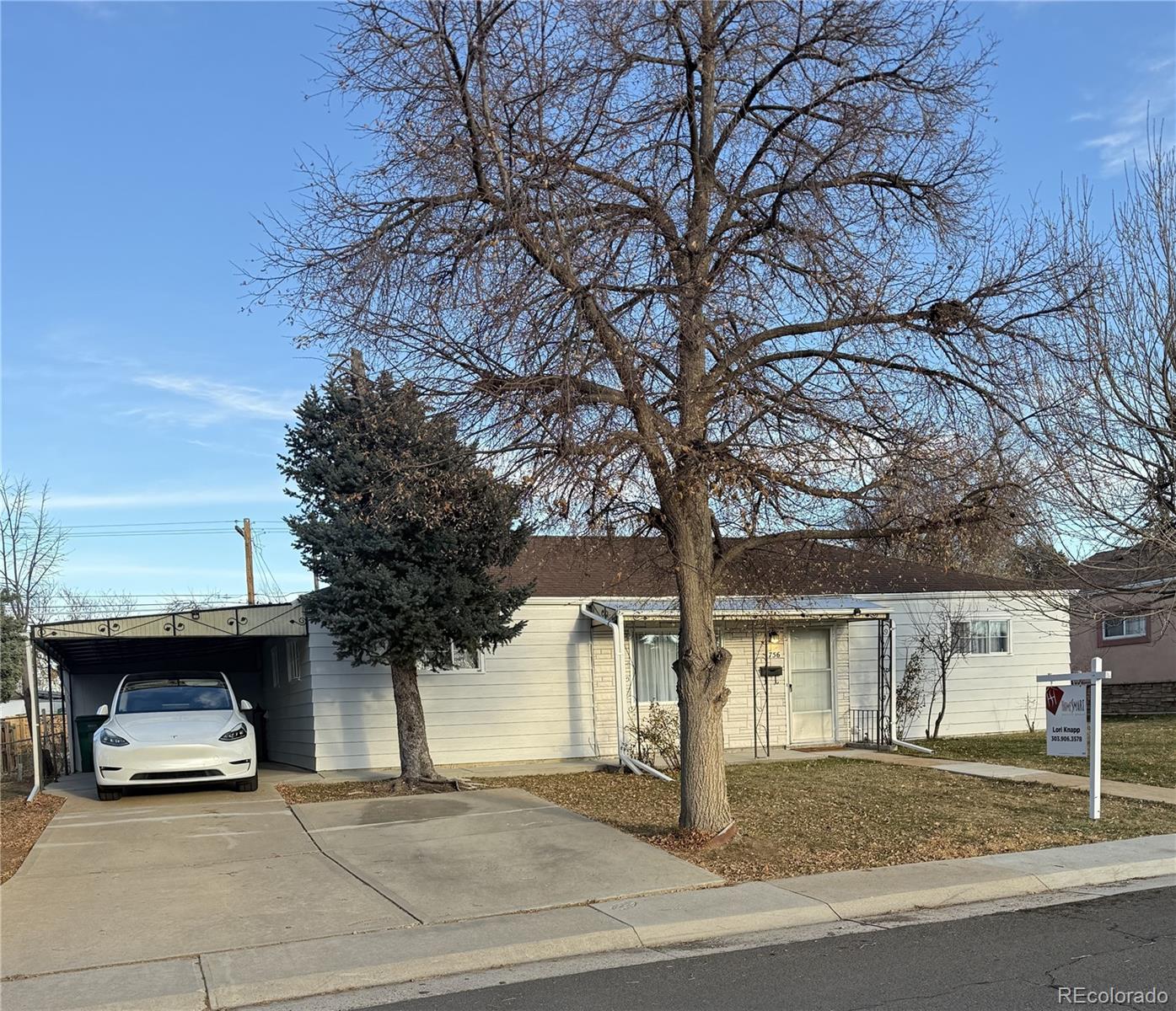 756 Vaughn Street Aurora, CO 80011 - Photo 1 of 22 a view of a car parked in front of a house