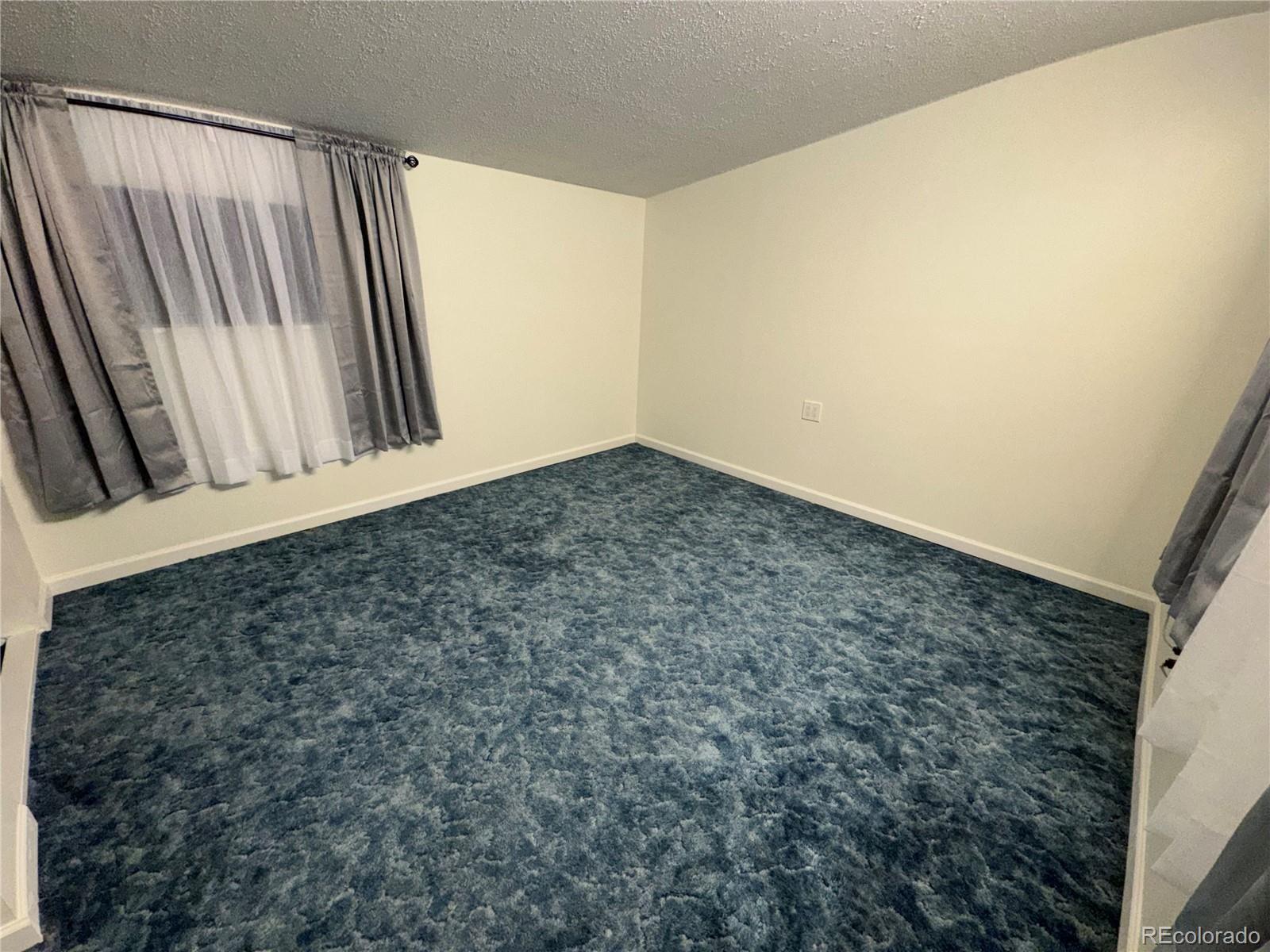 756 Vaughn Street Aurora, CO 80011 - Photo 17 of 22 a view of an empty room