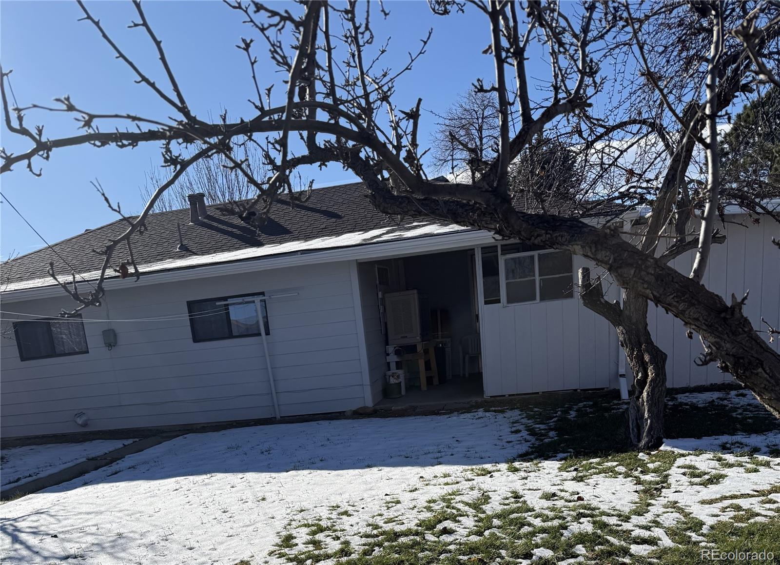 756 Vaughn Street Aurora, CO 80011 - Photo 19 of 22 a view of a house with a snow